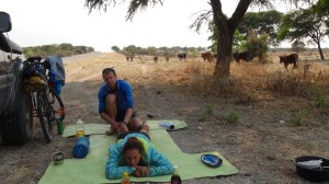 Communal farmland, means we've accidentally stopped for breakfast on the cows' route. Mike giving Emma a much needed but painful massage